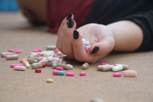 pills spilling out of hand