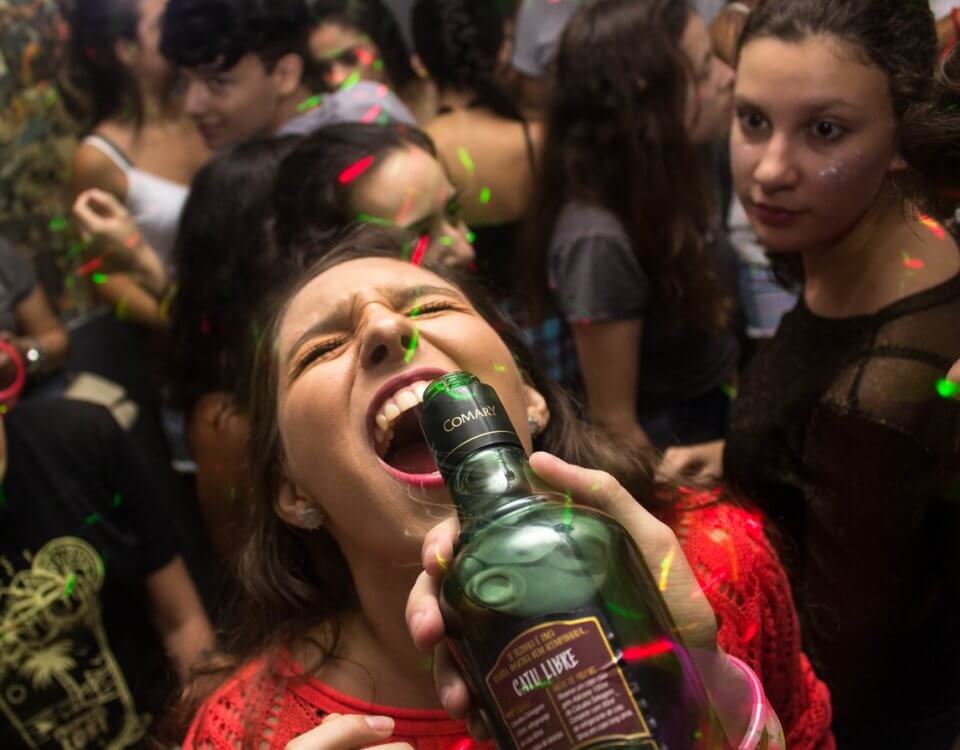woman drinking from bottle